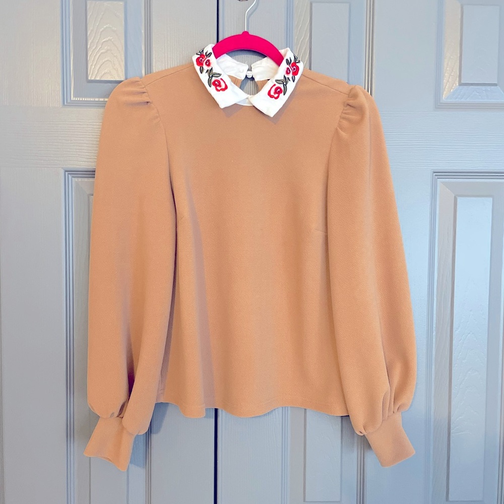 Brown / tan bell sleeve blouse with white floral collar.